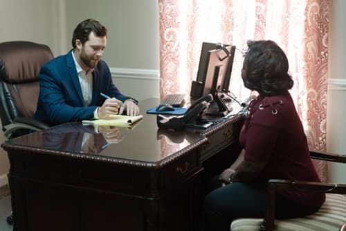 Brock & Stout Dothan attorney meeting with a client