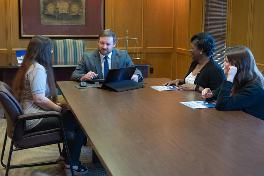 Brock & Stout attorneys meeting as a team