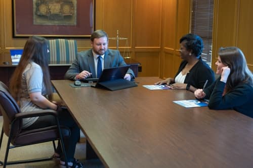 Brock & Stout attorneys meeting with a client