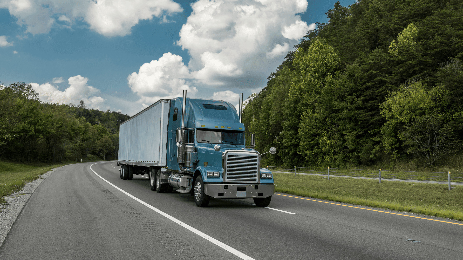 Commercial semi-truck traveling on a highway, illustrating vicarious liability in an Alabama personal injury case.