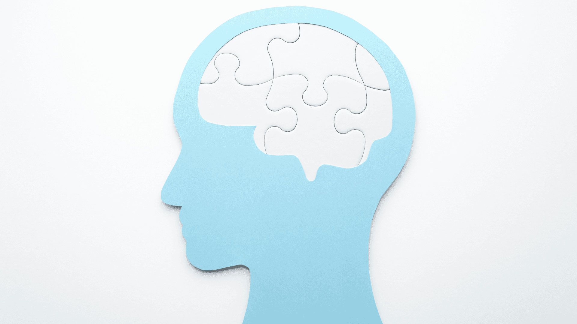 Mental health disability evidence represented by a head silhouette with puzzle pieces