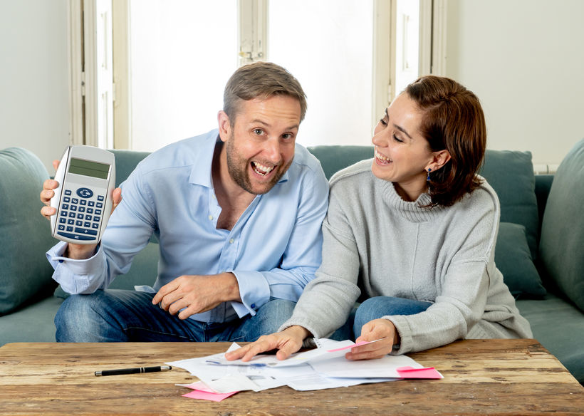 happy young couple feeling proud of finance