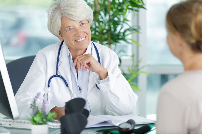 female doctor giving Social Security Disability Consultative Exam