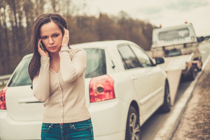 Woman calling while tow truck repossessing her car