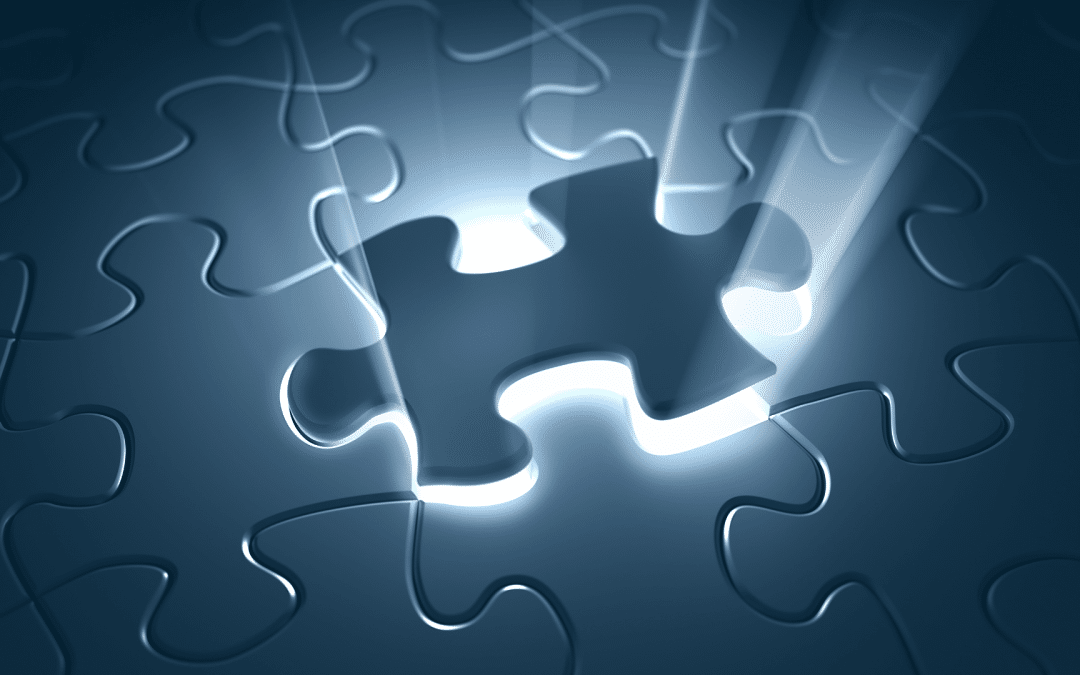 A missing puzzle piece in a blue jigsaw puzzle glowing with bright light as it fits into place.